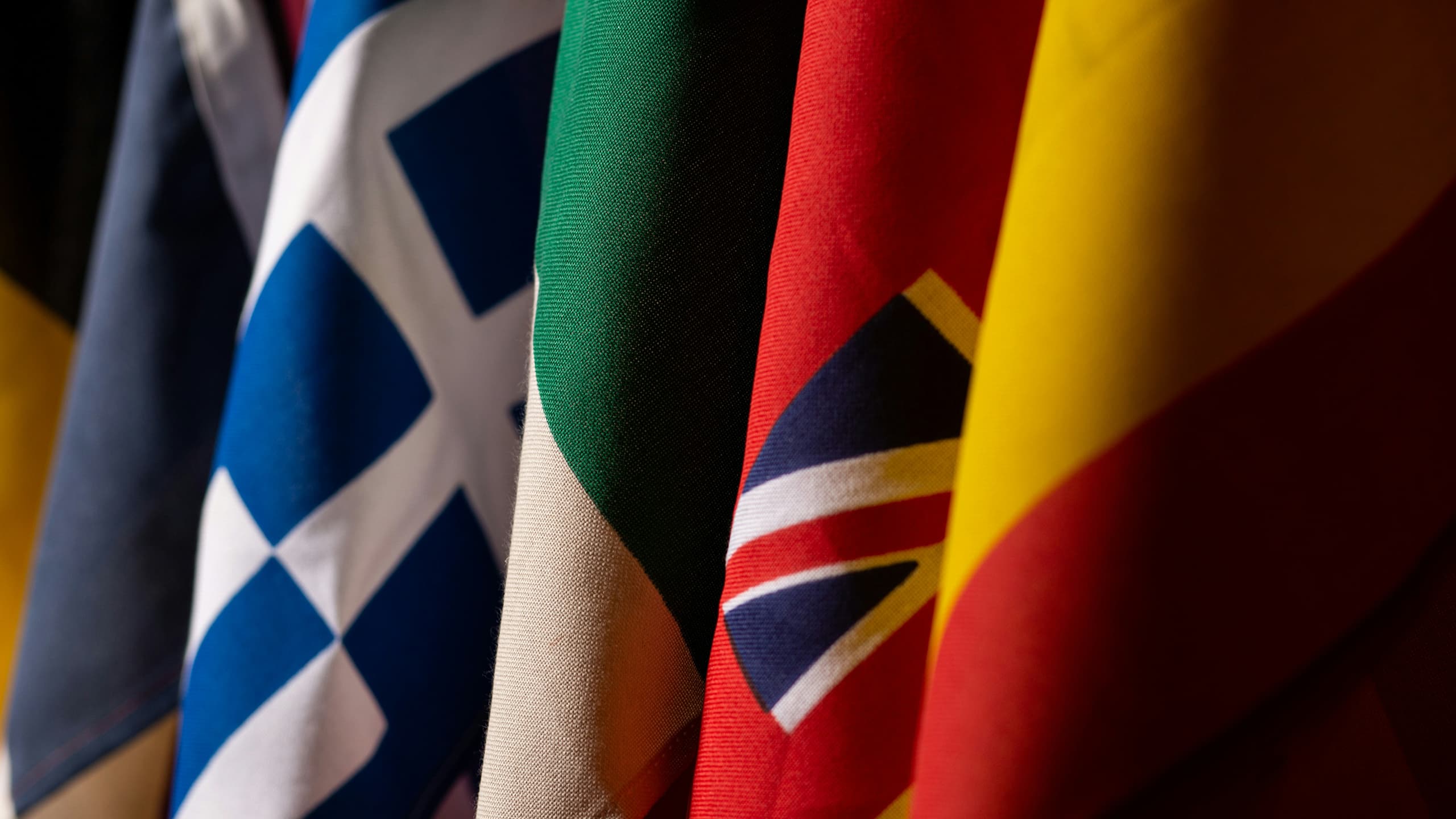 Flags of several countries arranged side by side, representing a documentation site published in multiple languages